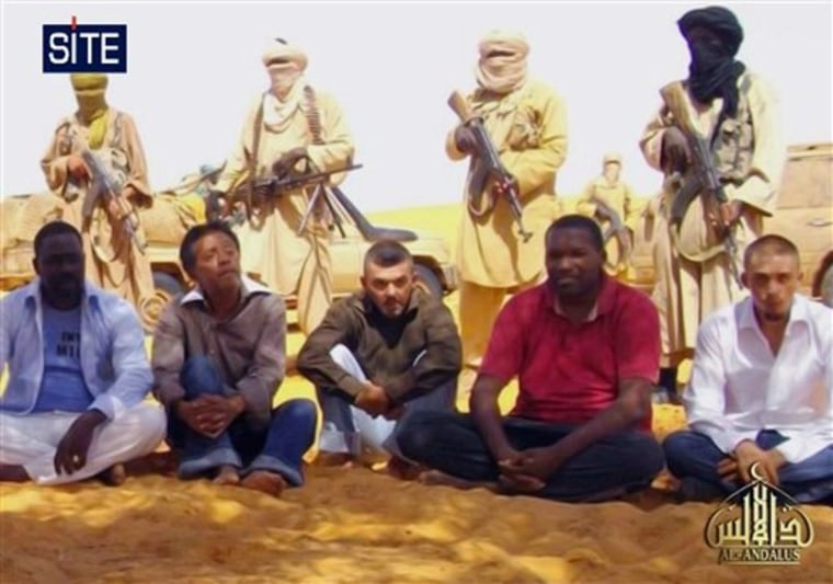 This image taken from video and provided by U.S.-based SITE Intelligence Group shows the first images of a group of foreign hostages working for a French energy company who were seized in Niger two weeks ago by an al-Qaida offshoot, according to the group that monitors terrorism. The hostages were grabbed in the middle of the night on Sept. 16 from their guarded villas in the uranium mining town of Arlit in Niger where they worked for French nuclear giant Areva. Five are French citizens, the other two are from Togo and Madagascar.